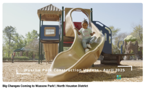 little girl sliding down a slide smiling 